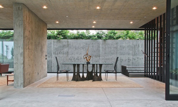 concrete-wall-floor-dining-area-table-metal-recessed-lighting