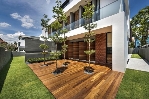 contemporary home exterior wooden deck trees 