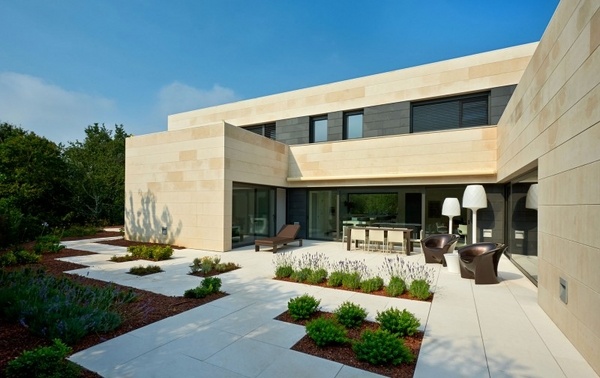 house exterior design ideas slabs low shrubs patio furniture