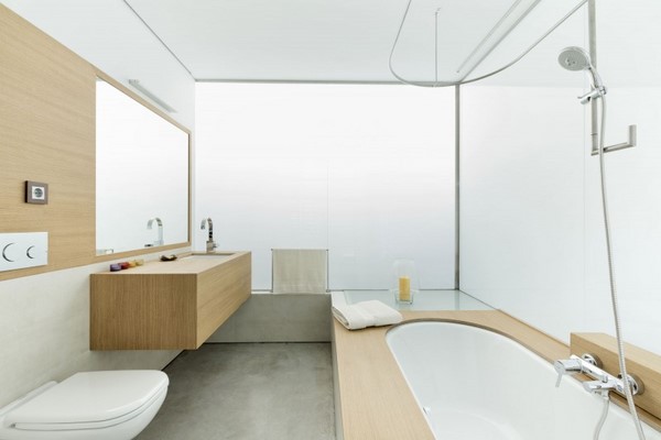 modern bathroom white walls light color wooden bathroom furniture bathtub