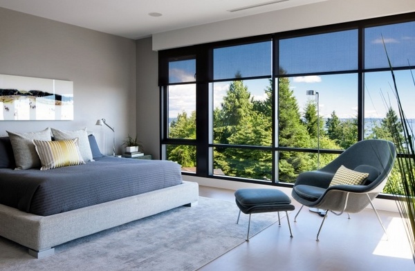 modern bedroom furniture gray wall color relax chair panorama window