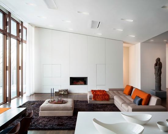 modern living room fireplace white wall brown carpet