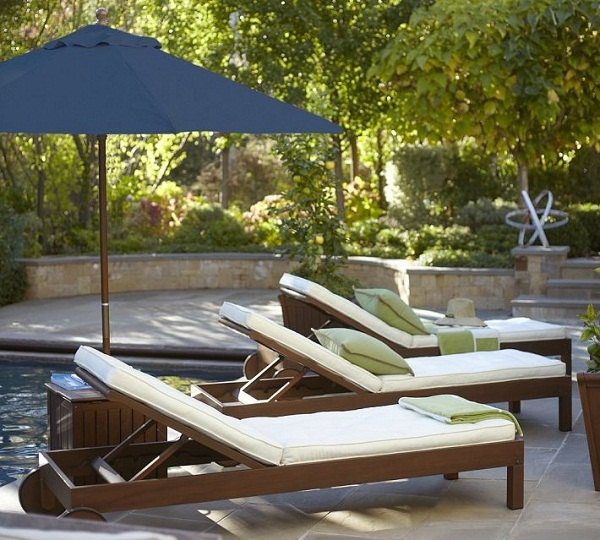 outdoor-lounge-furniture-swimming-pool-sunbeds-blue-umbrella
