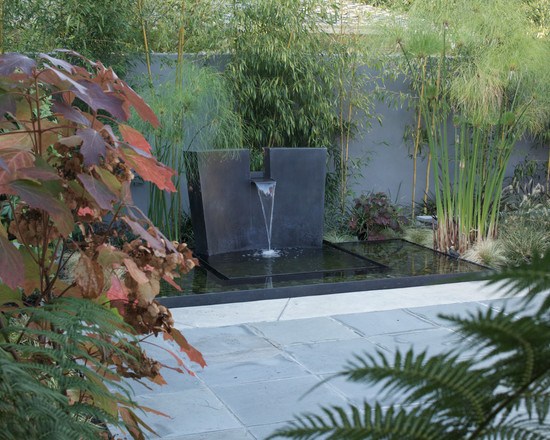 patio design garden water features black stone fountain bamboo trees