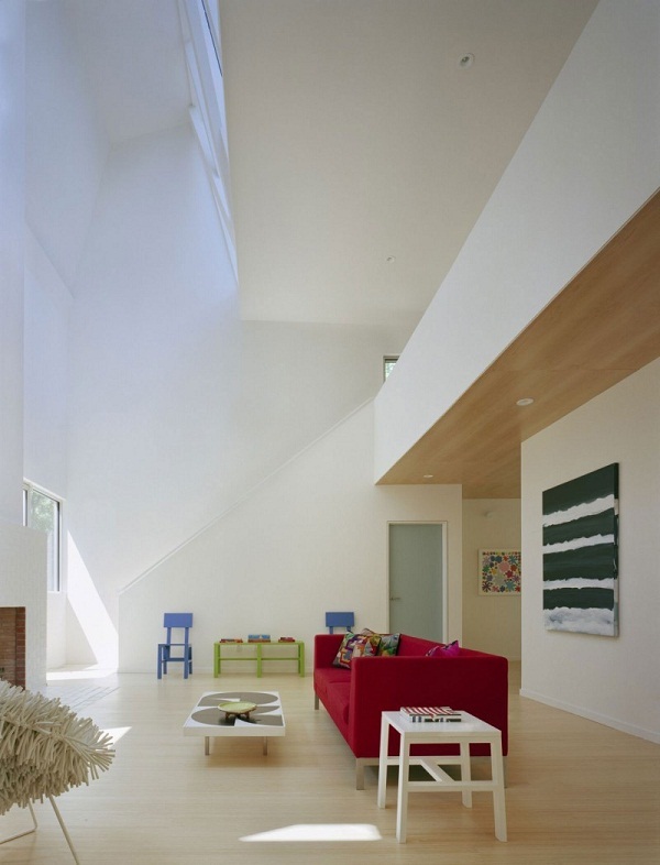 spacious interior design red sofa laminate flooring
