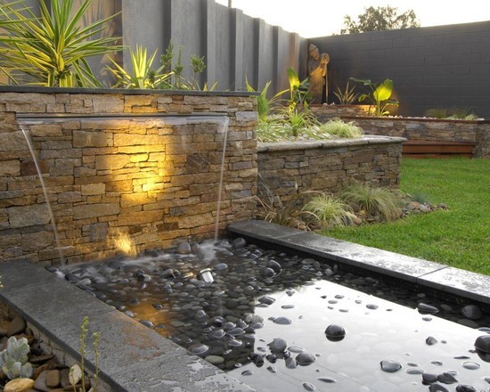 stylish modern garden stone wall waterfall basin with stones