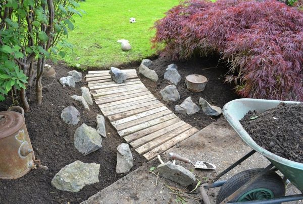 path dismantled pallets wooden slats stones