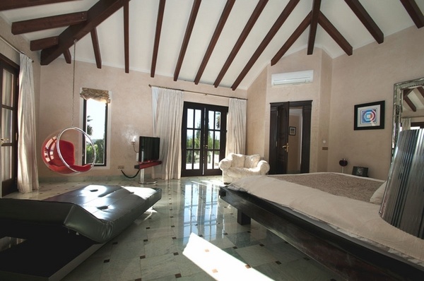 luxury villa Ibiza bedroom interior design wooden ceiling beams contemporary furniture