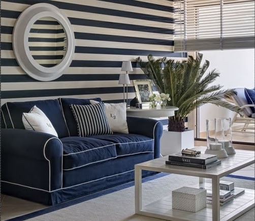 marine theme dark blue white stripes on the wall blue sofa