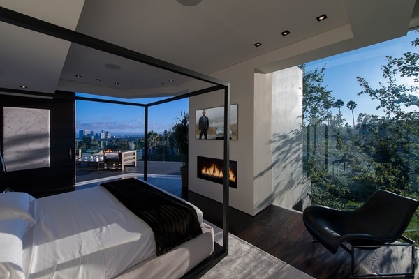 master bedroom interior design floor to ceiling windows fireplace