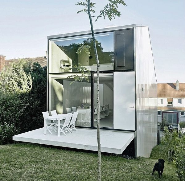 minimalist house architecture glass walls patio deck