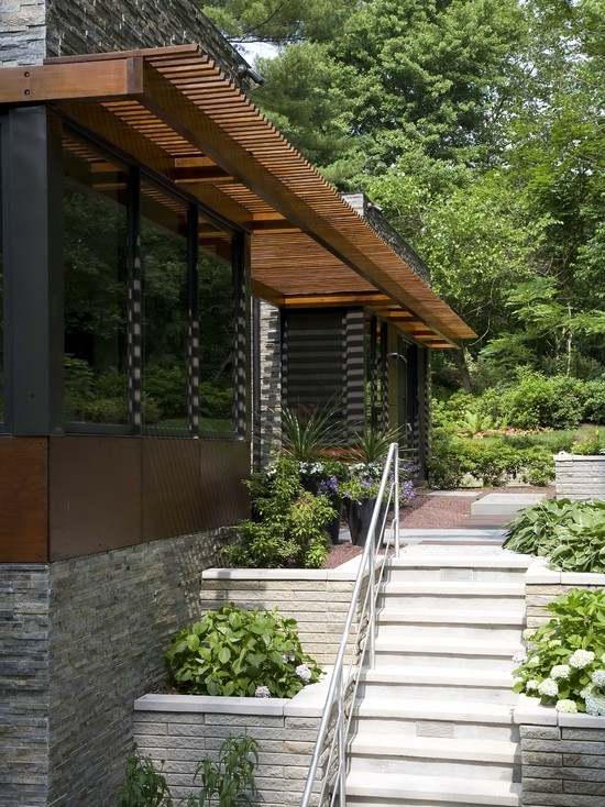 modern home exterior retaining walls flowers wooden pergola design
