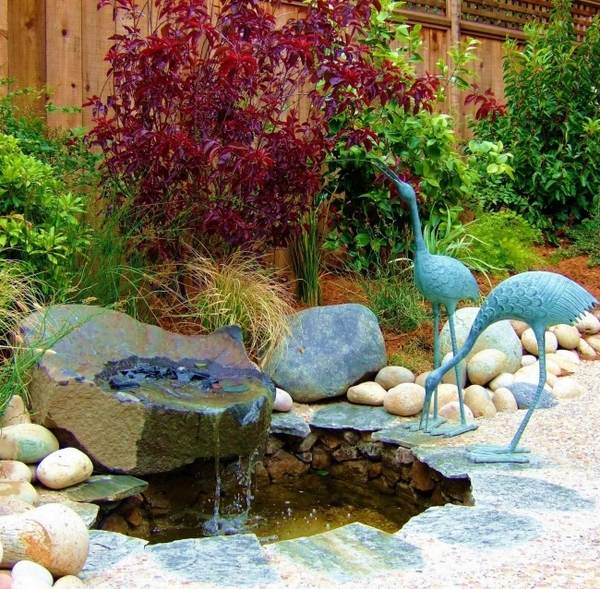 Asian style pond stones birds