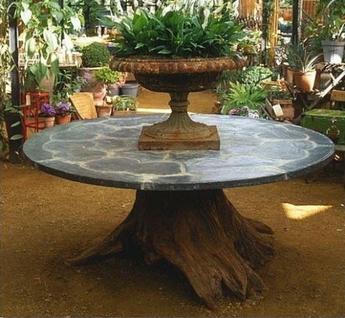 Decorating ideas with tree trunks elements in interior garden patio table