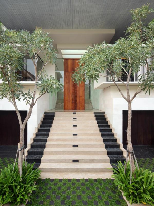 Modern house entrance trees grass
