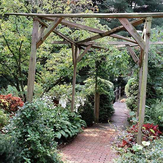 Rustic wooden pergola in the middle of the garden