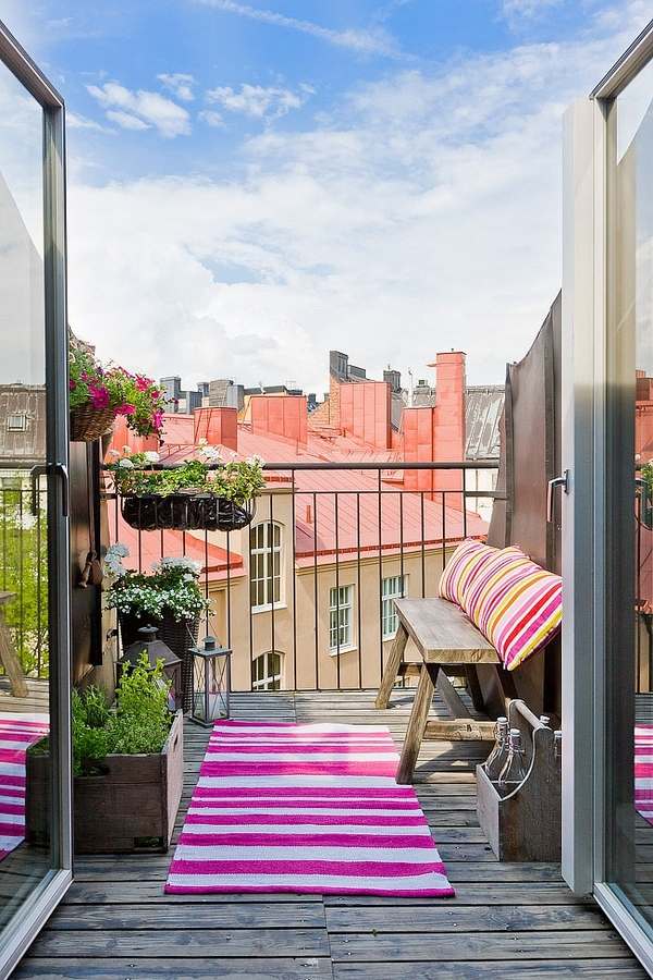 balcony design wooden bench pillows carpet pink stripes
