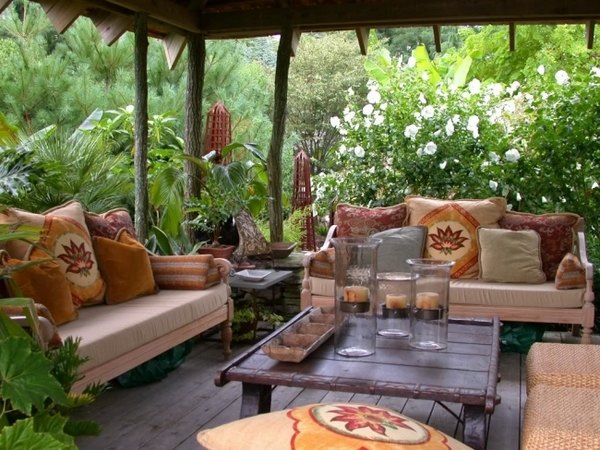 patio design ideas wooden canopy ethno pillows coffee table