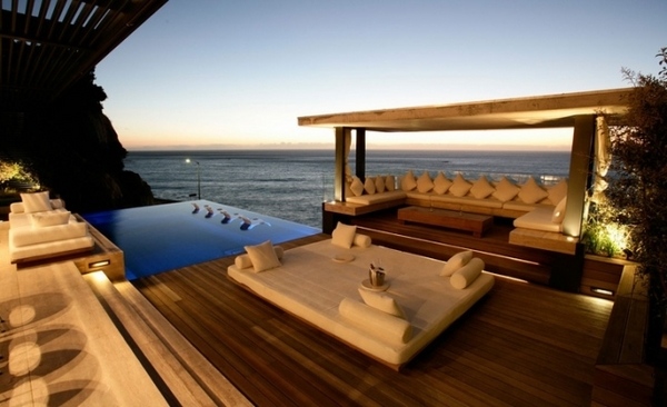 patio lounge beds Mediterranean atmosphere white pillows