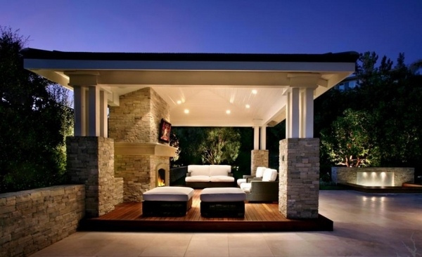 patio-pergola-wooden-deck-outdoor-fireplace-natural-stone-columns