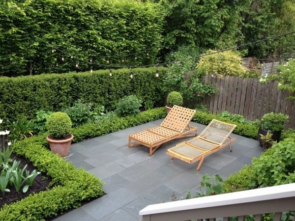 garden hedge privacy protection design terrace wooden chairs