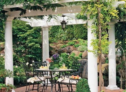 privacy-protection-in-the-garden-hedge-white-pergola-wrought-iron-furniture
