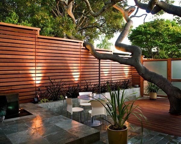 small design patio tree wooden deck privacy fence
