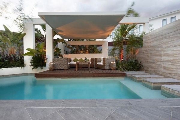 patio pool platform wood deck canopy palm tree backdrop