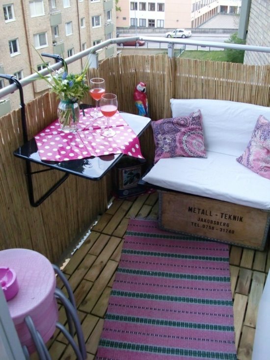 Balcony bamboo screenslow bench small table pink accents