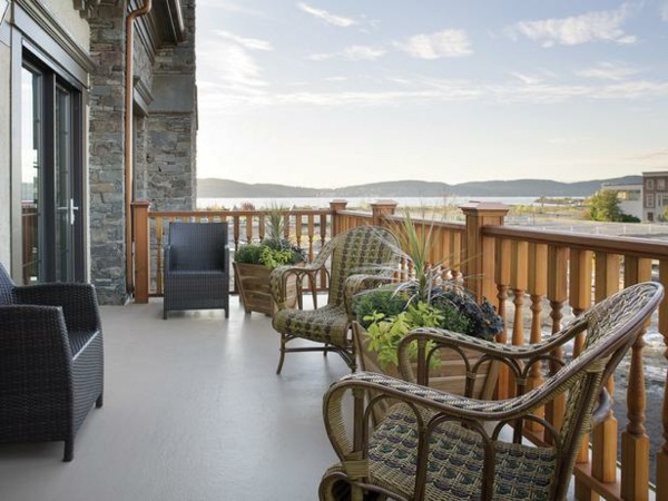 Balcony design tips wooden railing outdoor furniture design ideas