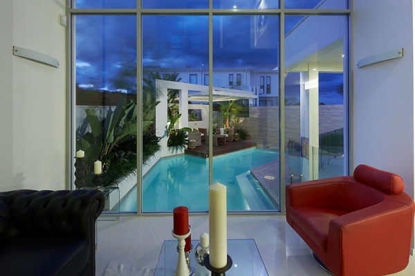 Luxury house view to garden pool red chair