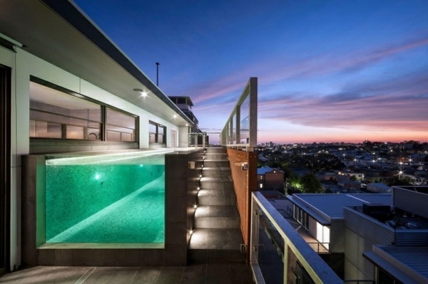 Penthouse freestanding pool green lighting glass wall