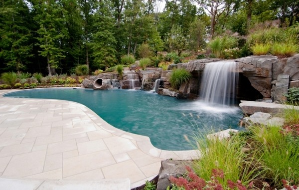 Swimming pool Waterfall natural stones deck