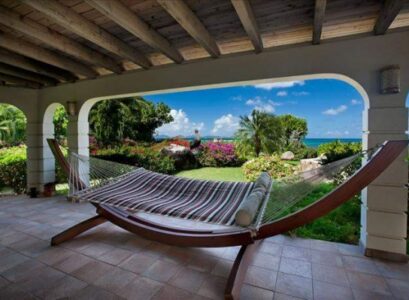 Wooden-frame-hammock-covered-patio