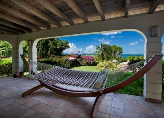 Wooden-frame-hammock-covered-patio