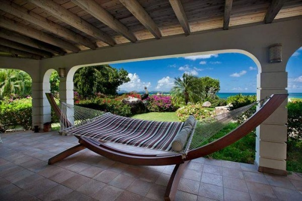 Wooden frame hammock covered patio