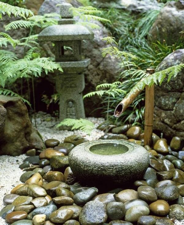 bamboo water feature in japanese garden 