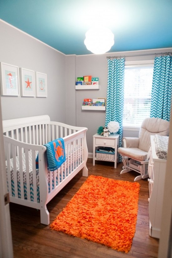 blue baby room design orange rug