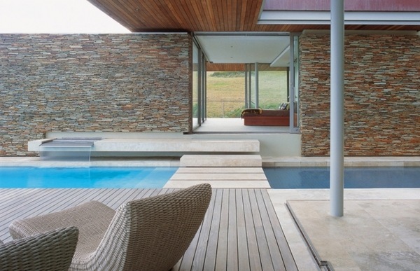 garden pool wooden deck natural stone facade