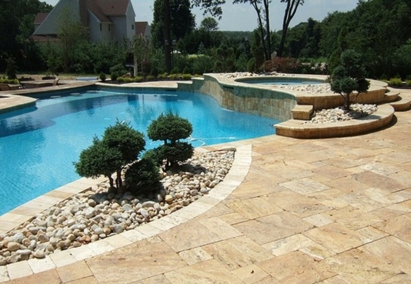 garden pool stone edge shrubs stone tiles