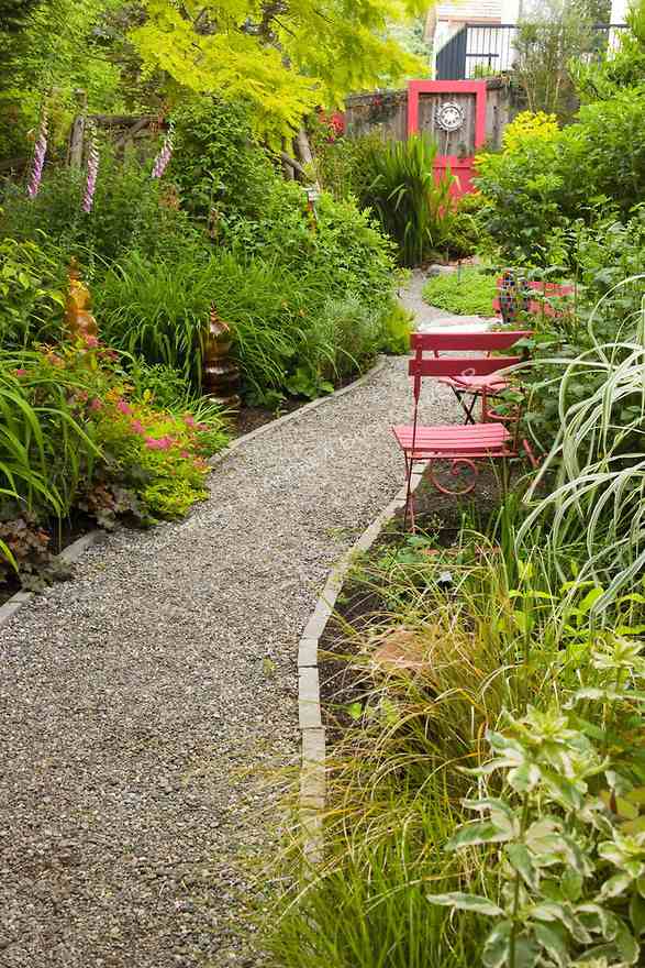 gravel path in garden stone border plants garden path ideas
