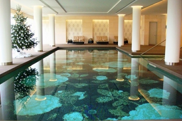 large indoor pool hotel mosaic tiles green
