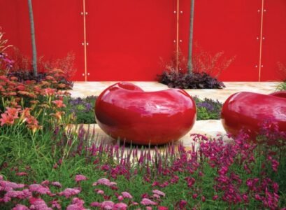 red-stools-wooden-fence-red-color-spring-flowers