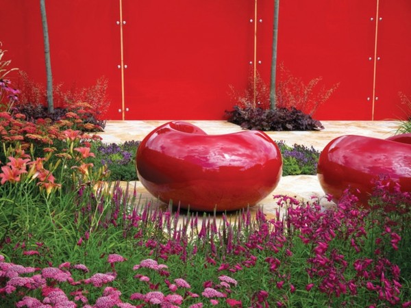 red stools wooden fence red color spring flowers