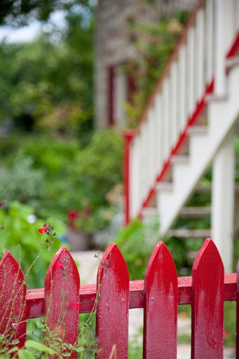 red wooden garden fence wooden slats