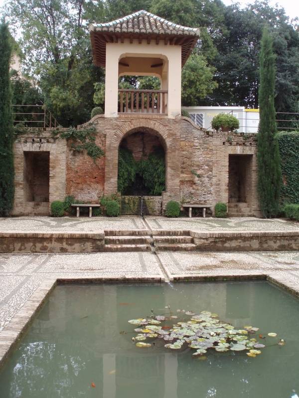 traditional spanish garden stone tiles pool
