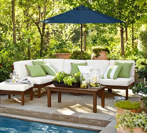 Decorating ideas for spring blue parasol sofa table pool