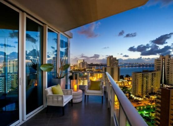 Glass-balcony-railing-furniture-beautiful-view-city-skyline