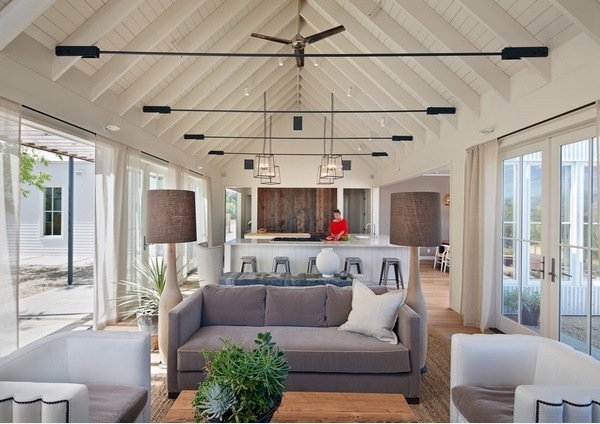 vaulted ceiling white color pendant lighting open floor plan living room modern furniture