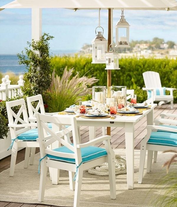 outdoor dining set white wood parasol hanging lanterns